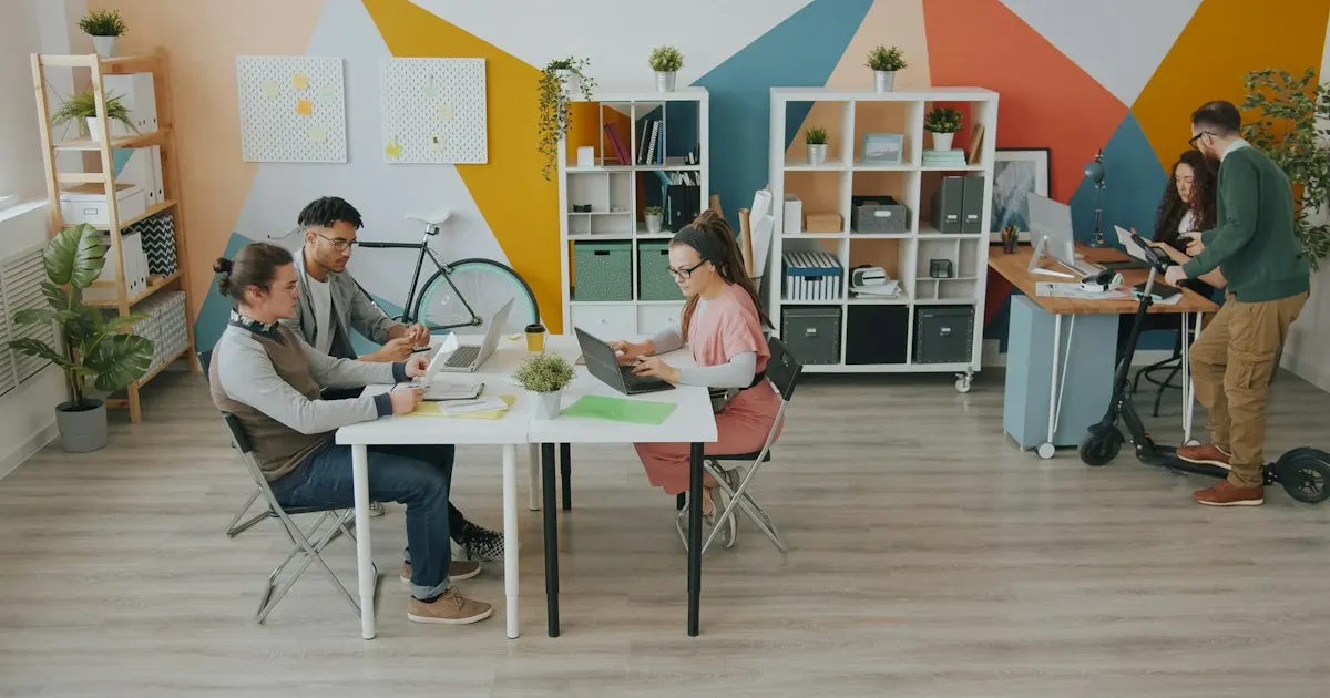 Colorful modern startup office with people working at desks